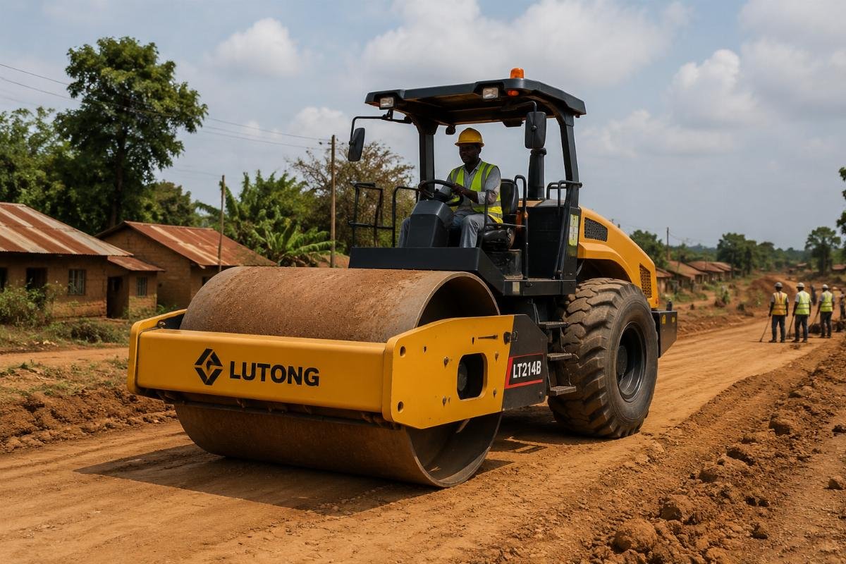 Single-drum vibratory road roller operating on a rural road construction site in Africa