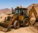 Backhoe loader operating on a desert road construction site